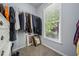 A walk-in closet featuring ample hanging space and natural light from a window at 295 River Laurel Way, Woodstock, GA 30188