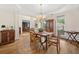Elegant dining room features hardwood floors, stylish furnishings, a chandelier and natural lighting at 295 River Laurel Way, Woodstock, GA 30188