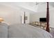 The main bedroom has a four poster bed, sitting area, and a trey ceiling at 295 River Laurel Way, Woodstock, GA 30188