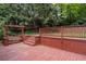 Cozy backyard deck area with a swing provides a serene outdoor space bordered by greenery at 4052 Shawnee Ne Ln, Brookhaven, GA 30319