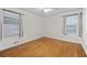 Bedroom with wood floors and two windows providing ample natural light at 4052 Shawnee Ne Ln, Brookhaven, GA 30319