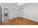 Bedroom with wood floors, closet, and a hallway leading to other rooms at 4052 Shawnee Ne Ln, Brookhaven, GA 30319