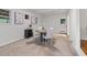 Bright dining room with white walls, wood table, and access to the back deck at 4052 Shawnee Ne Ln, Brookhaven, GA 30319