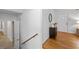 Bright foyer featuring hardwood floors, a decorative front door, and a staircase at 4052 Shawnee Ne Ln, Brookhaven, GA 30319