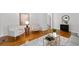 Cozy living room with hardwood floors, light gray chairs, and stylish decor at 4052 Shawnee Ne Ln, Brookhaven, GA 30319