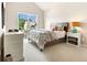 Bright bedroom featuring vaulted ceiling, natural light, and neutral tones for a relaxing retreat at 4779 Moon Hollow Ct, Buford, GA 30519