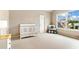 Bright bedroom with large window and neutral decor at 4779 Moon Hollow Ct, Buford, GA 30519