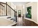 Elegant foyer with hardwood floors, staircase, and view of the front door at 4779 Moon Hollow Ct, Buford, GA 30519