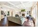 Elegant living room with hardwood floors, a stone fireplace, and built-in shelving at 4779 Moon Hollow Ct, Buford, GA 30519