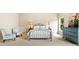 Bright main bedroom features stylish furniture and ample natural light at 4779 Moon Hollow Ct, Buford, GA 30519