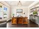 Bright office with large windows, custom cabinetry, and hardwood floors at 4779 Moon Hollow Ct, Buford, GA 30519
