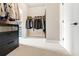 A spacious walk-in closet features custom shelving, drawers, and ample storage space at 4779 Moon Hollow Ct, Buford, GA 30519