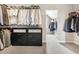 Spacious walk-in closet with ample storage, featuring built-in drawers and shelving for optimal organization at 4779 Moon Hollow Ct, Buford, GA 30519