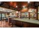 The wet bar features granite countertops and custom lighting at 6330 Spinnaker Ln, Alpharetta, GA 30005