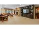 Basement features built-in shelves, a stone fireplace, and plush carpet at 6330 Spinnaker Ln, Alpharetta, GA 30005