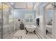 Bright bathroom features a clawfoot tub, chandelier, and white cabinets at 6330 Spinnaker Ln, Alpharetta, GA 30005