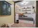 Cozy bedroom with a daybed, decorative shelves, and a charming rustic design at 6330 Spinnaker Ln, Alpharetta, GA 30005
