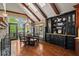 Charming breakfast nook featuring wooden floors, beamed ceilings, and plenty of natural light with views of the outdoor landscape at 6330 Spinnaker Ln, Alpharetta, GA 30005
