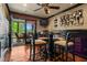 Elegant dining room with a ceiling fan, wall decorations, and a view of the outdoor patio at 6330 Spinnaker Ln, Alpharetta, GA 30005