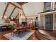 Elegant dining room featuring hardwood floors, vaulted wood beam ceilings, and classic chandelier lighting at 6330 Spinnaker Ln, Alpharetta, GA 30005