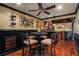 Elegant dining room features a stylish table, decorative lighting, and a charming bar area at 6330 Spinnaker Ln, Alpharetta, GA 30005
