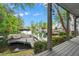 Scenic view of the lake from a porch, showcasing a boat dock and waterfront homes at 6330 Spinnaker Ln, Alpharetta, GA 30005