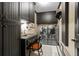 Functional laundry room with built-in cabinets, workspace, and modern washer and dryer at 6330 Spinnaker Ln, Alpharetta, GA 30005