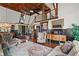 Living room showcases a high ceiling, decorative fireplace, and hardwood floors at 6330 Spinnaker Ln, Alpharetta, GA 30005