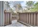 Private backyard with stone pavers and wood fence featuring access gate at 1205 Druid Knoll Ne Dr, Brookhaven, GA 30319