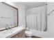 Clean bathroom with a shower-tub combo, modern vanity, and stylish tile floor at 1205 Druid Knoll Ne Dr, Brookhaven, GA 30319