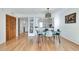 Charming dining area with hardwood floors and an open view into the kitchen at 1205 Druid Knoll Ne Dr, Brookhaven, GA 30319