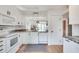 Clean kitchen features white cabinets, granite countertops, and stainless steel appliances at 1205 Druid Knoll Ne Dr, Brookhaven, GA 30319
