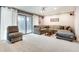 Inviting living room with plush sectional sofa and access to outdoor area through sliding glass doors at 1205 Druid Knoll Ne Dr, Brookhaven, GA 30319