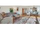 Cozy living room with hardwood floors, a plush sofa, and an open layout at 1205 Druid Knoll Ne Dr, Brookhaven, GA 30319