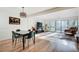 Open-concept living space with dining area, hardwood floors, and ample natural light at 1205 Druid Knoll Ne Dr, Brookhaven, GA 30319