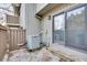 Private patio with stone floor, wooden fence, and sliding door access at 1205 Druid Knoll Ne Dr, Brookhaven, GA 30319