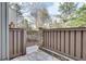 Enclosed patio with stone floor and wooden fence at 1205 Druid Knoll Ne Dr, Brookhaven, GA 30319