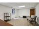 Finished basement with a large window providing natural light and recessed ceiling lights at 211 Black Kettle Ln, Johns Creek, GA 30022