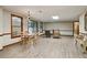 Basement includes a dining area, comfortable seating, and large windows at 211 Black Kettle Ln, Johns Creek, GA 30022
