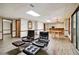 Basement with a bar area, cozy seating, wood-look floors, and ample space for recreation at 211 Black Kettle Ln, Johns Creek, GA 30022