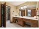 Bathroom features a large mirror over wooden vanity with integrated cabinets and drawers at 211 Black Kettle Ln, Johns Creek, GA 30022