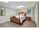 Bedroom featuring a wood frame bed, wood look floors, and natural light at 211 Black Kettle Ln, Johns Creek, GA 30022