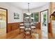 Cozy dining area with backyard views and modern light fixture at 211 Black Kettle Ln, Johns Creek, GA 30022