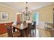Elegant dining room with wainscoting, a chandelier, and hardwood floors at 211 Black Kettle Ln, Johns Creek, GA 30022