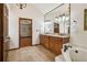 A large bathroom features a double vanity, soaking tub, and walk-in shower at 211 Black Kettle Ln, Johns Creek, GA 30022
