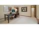 Neutral toned office with a large desk, and lots of natural light at 211 Black Kettle Ln, Johns Creek, GA 30022
