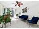 Bright sunroom with tile floors, lots of light, multiple windows, and views of the backyard at 211 Black Kettle Ln, Johns Creek, GA 30022