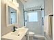 Contemporary bathroom with a white vanity, sleek fixtures, and a glass-enclosed shower at 217 Penelope Nw Dr, Atlanta, GA 30314