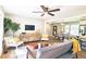 Cozy living room showcasing a modern design with hardwood floors and an open floor plan to the dining area at 217 Penelope Nw Dr, Atlanta, GA 30314