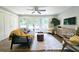 Bright and airy living room with modern furniture, hardwood floors, and access to a patio at 217 Penelope Nw Dr, Atlanta, GA 30314